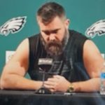 Jason Kelce seated at Eagles News Conference reading his retirement speech